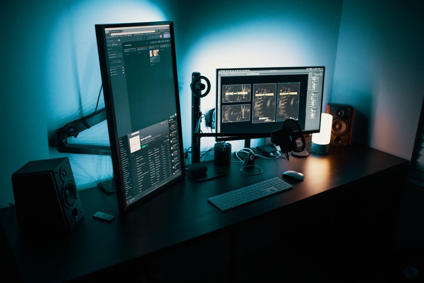 A quiet desk setup with two monitors in low evening light